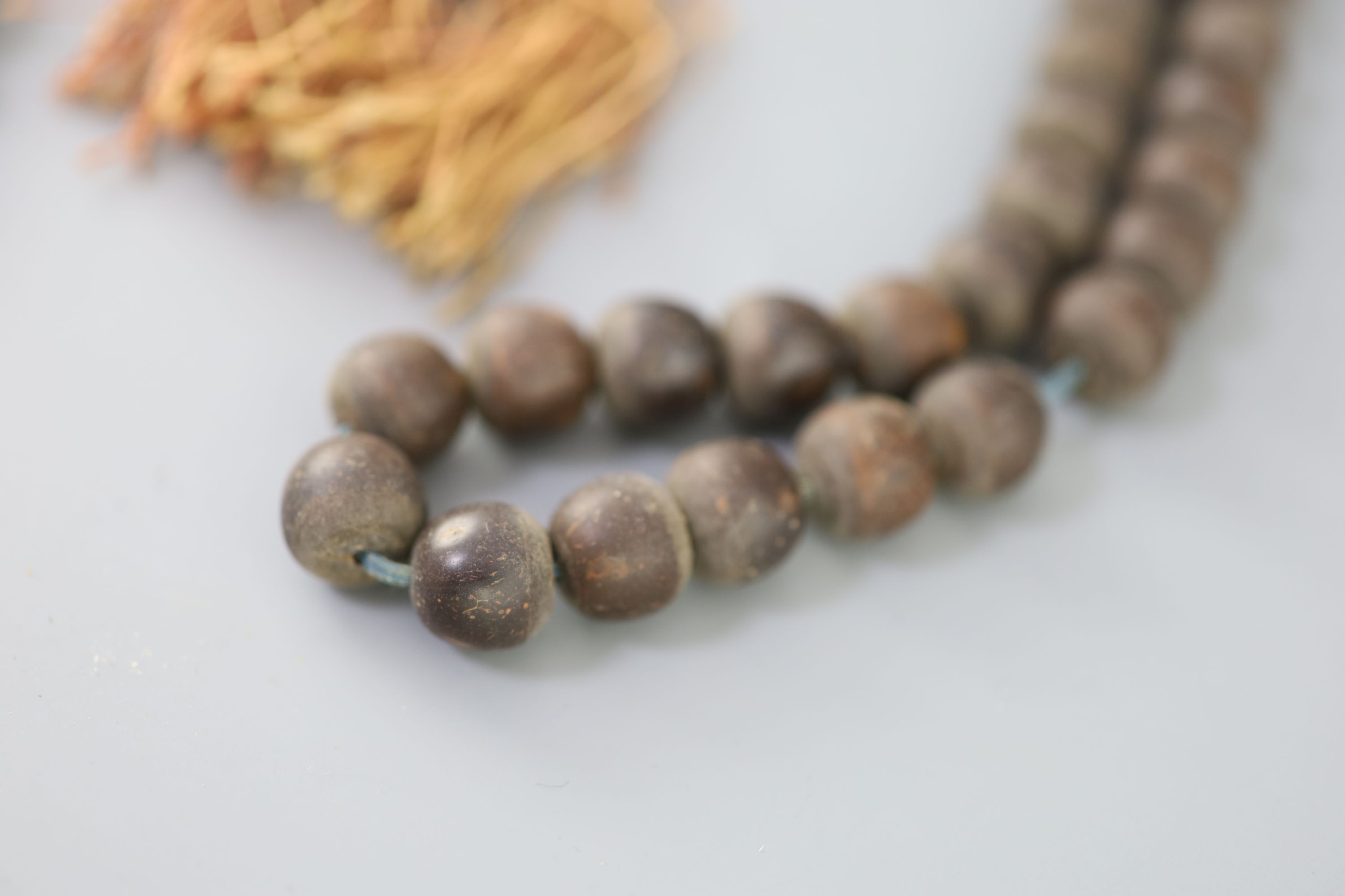 A Sino-Tibetan Buddhist seed bead rosary, 19th century and a Chinese composition bead rosary, early 20th century Provenance - A. T. Arb
